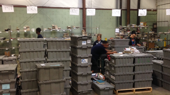 Stacks of bins in courier warehouse